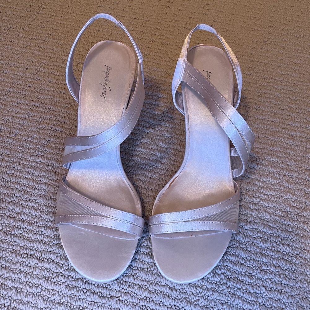 Ivory satin heels.